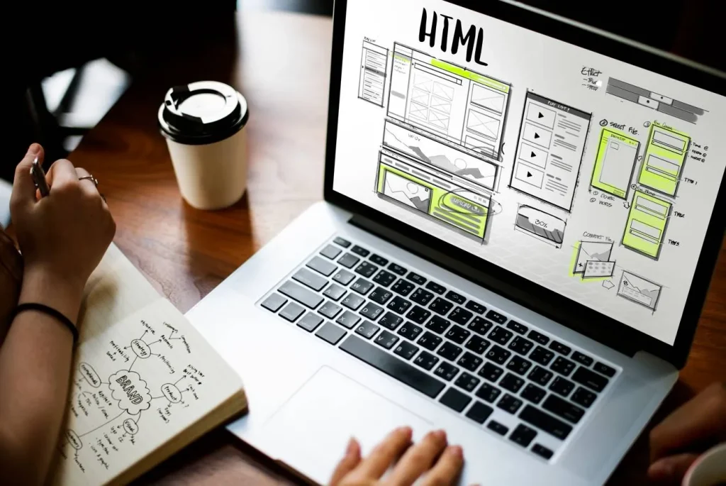 HTML web design planning on laptop screen