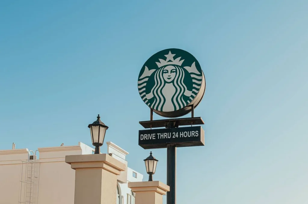 Starbucks drive thru sign with iconic brand logo