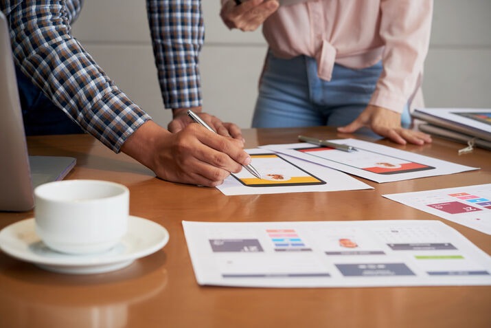 Design team reviewing brand identity and rebranding concepts
